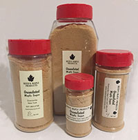 granulated maple sugar in various size plastic containers